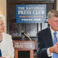 Haas and Marcia continue to be addressed in the front of the room